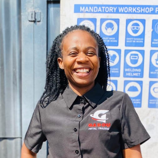 Professional portrait of Hulisani Ndou, Founder and Executive Leadership in business attire with warm smile